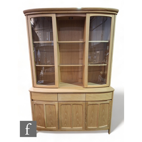 1118 - Nathan Furniture - A contemporary teak sideboard display case, the curved cabinet with cupboard pane... 