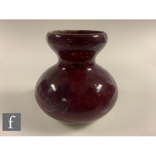 129 - Ruskin Pottery - A 1930s pottery vase of double gourd form decorated in a high fired glaze with purp... 