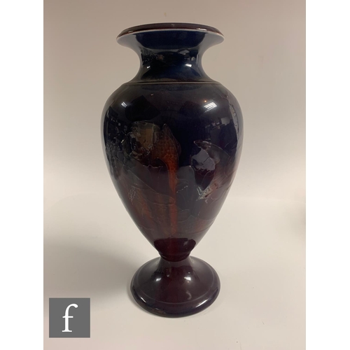 185 - William Moorcroft - A large pedestal vase circa 1915/20, the footed shouldered ovoid body rising to ... 