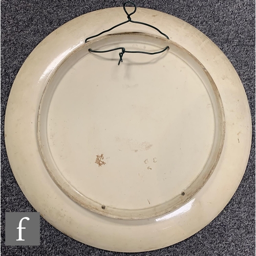 72 - Minton - In the manner of W. S. Coleman - A large shallow circular dish form charger circa 1880, han... 