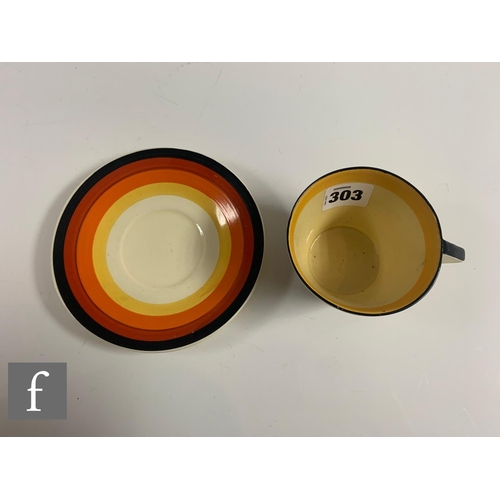 303 - Clarice Cliff - House & Bridge - A Conical tea cup and saucer circa 1931, hand painted with a st... 