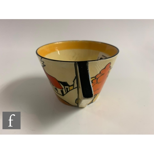 303 - Clarice Cliff - House & Bridge - A Conical tea cup and saucer circa 1931, hand painted with a st... 