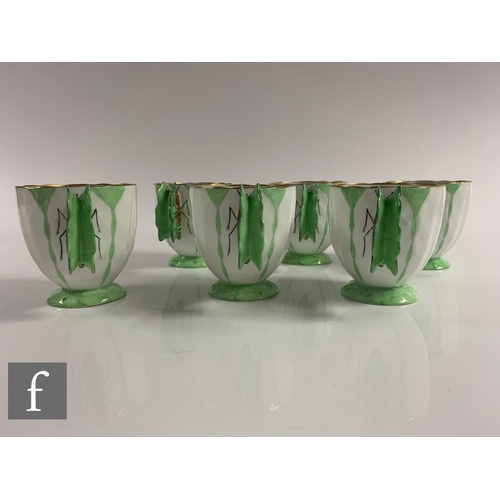 553 - Aynsley - An Art Deco butterfly and leaf moulded coffee set, pattern B1322, the handles modelled as ... 