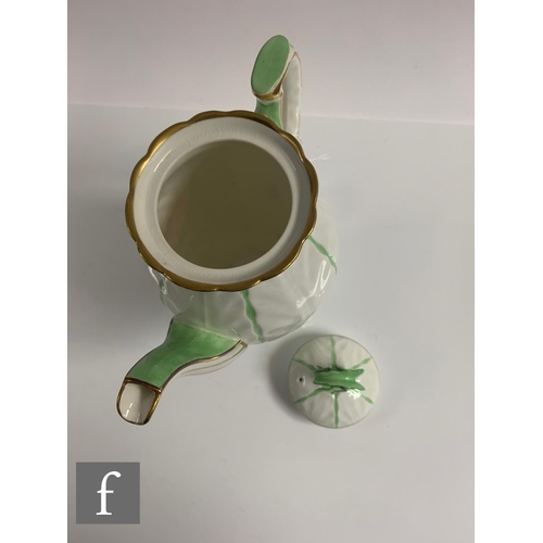 553 - Aynsley - An Art Deco butterfly and leaf moulded coffee set, pattern B1322, the handles modelled as ... 