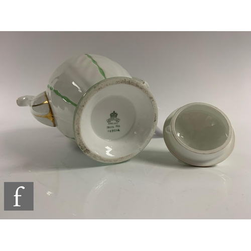 553 - Aynsley - An Art Deco butterfly and leaf moulded coffee set, pattern B1322, the handles modelled as ... 