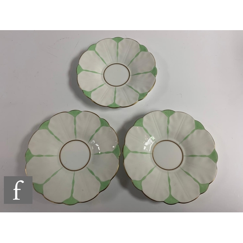 553 - Aynsley - An Art Deco butterfly and leaf moulded coffee set, pattern B1322, the handles modelled as ... 