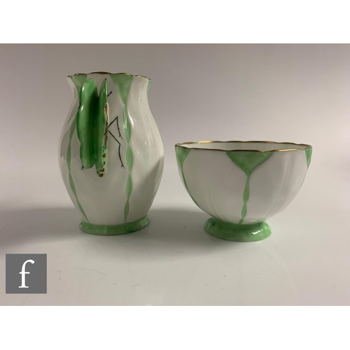 553 - Aynsley - An Art Deco butterfly and leaf moulded coffee set, pattern B1322, the handles modelled as ... 