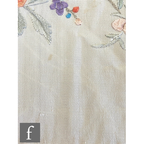 856 - A 1920s Chinoiserie embroidered Manila (or piano) shawl, the ivory silk ground with red, pink, blue ... 