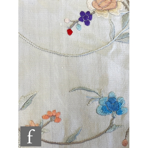 856 - A 1920s Chinoiserie embroidered Manila (or piano) shawl, the ivory silk ground with red, pink, blue ... 