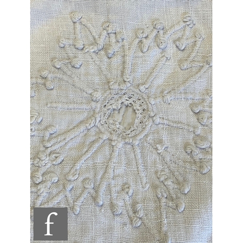 857 - A large late 19th to early 20th Century white cotton bedspread with a contrasting white floral desig... 