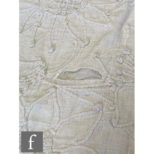 857 - A large late 19th to early 20th Century white cotton bedspread with a contrasting white floral desig... 