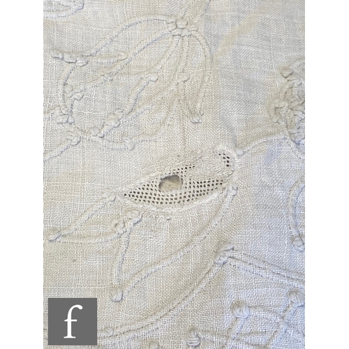 857 - A large late 19th to early 20th Century white cotton bedspread with a contrasting white floral desig... 