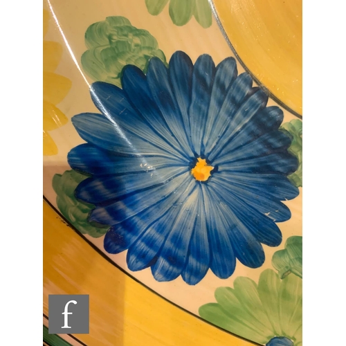 439 - Clarice Cliff - Sungay - An 18 inch ribbed charger circa 1931, hand painted with a border of flowers... 