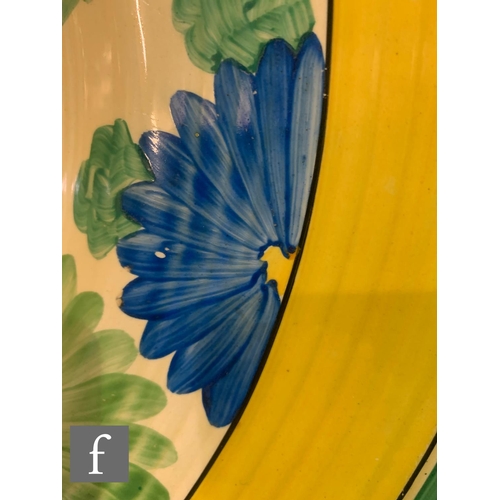 439 - Clarice Cliff - Sungay - An 18 inch ribbed charger circa 1931, hand painted with a border of flowers... 