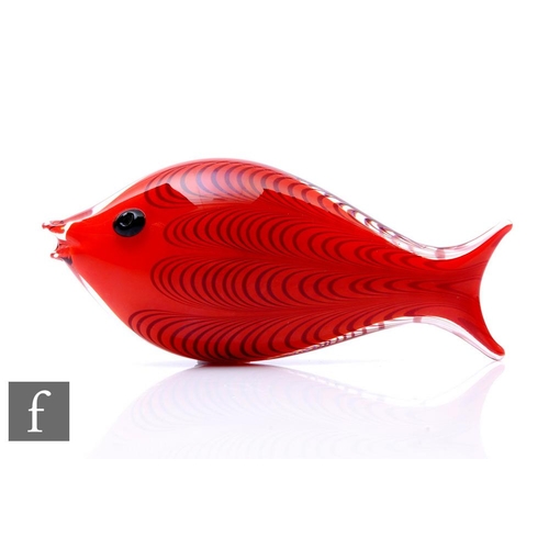 Ken Scott - Venini - An Italian glass fish sculpture circa 1951, with a red core cased in clear with pulled loop decoration, applied eye, acid marked, length 14.5cm.