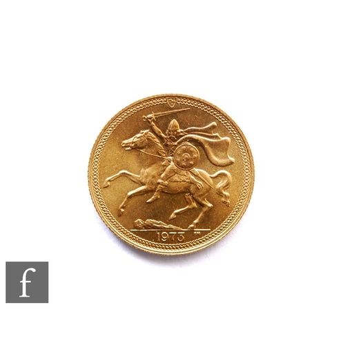 269 - Elizabeth II - A 1973 sovereign, Isle of Man, reverse Norse warrior on horseback.