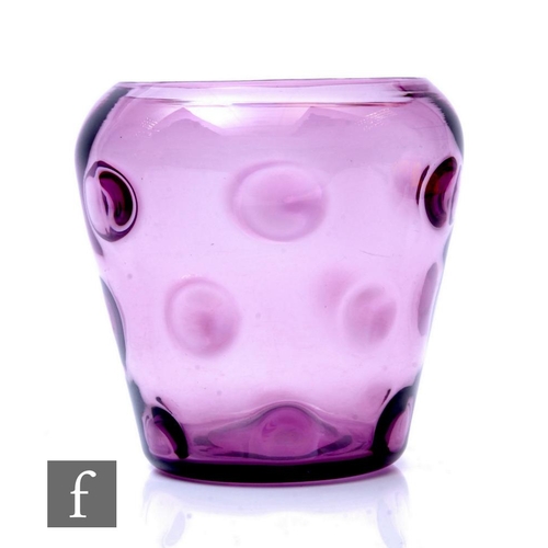 407 - A 1930s Thomas Webb and Sons glass vase of ovoid form, moulded with an optic bullseye pattern in pal... 