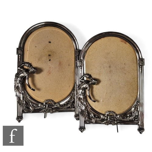 267 - A pair of WMF silver coloured easel photograph frames, each with a classical maiden with outstretche... 