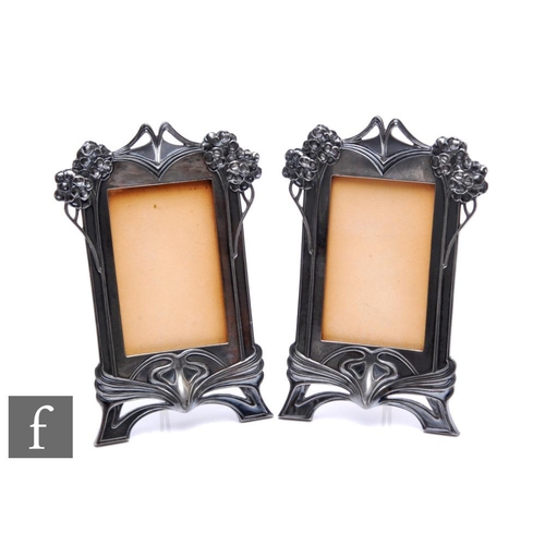 273 - A pair of WMF polished pewter rectangular easel photograph frames with whiplash and floral highlight... 