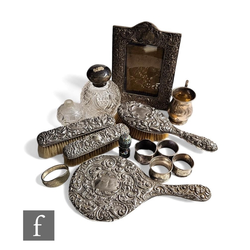 287 - A parcel lot of assorted hallmarked silver and other items to include napkin rings, a scent bottle, ... 