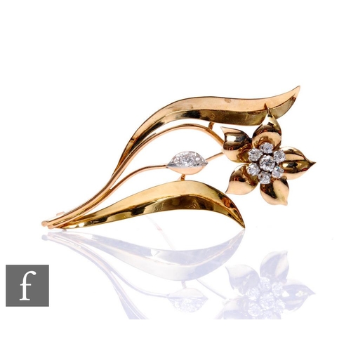 62 - An 18ct floral spray brooch set with a cluster of seven old cut, claw set diamonds, total weight app... 