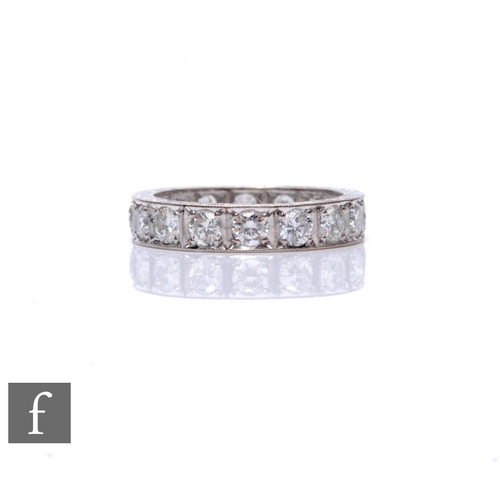 75 - An 18ct hallmarked white gold, diamond full eternity ring comprising sixteen brilliant cut stones, t... 