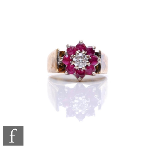 77 - An 18ct hallmarked ruby and diamond cluster ring, central diamond within an eight stone border, weig... 