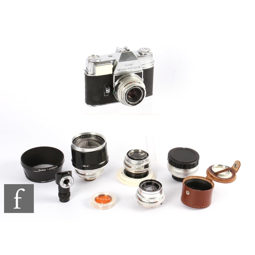 899 - A Kodak Retina Reflex III outfit, with additional lenses and accessories.