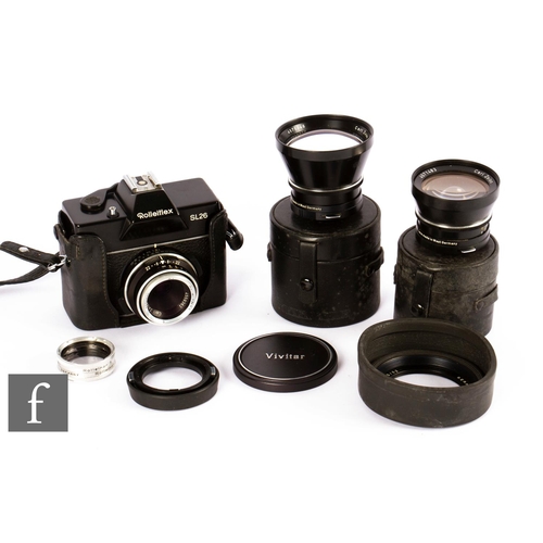 903 - A Rolleiflex SL25 camera outfit, comprising body and three various lenses.