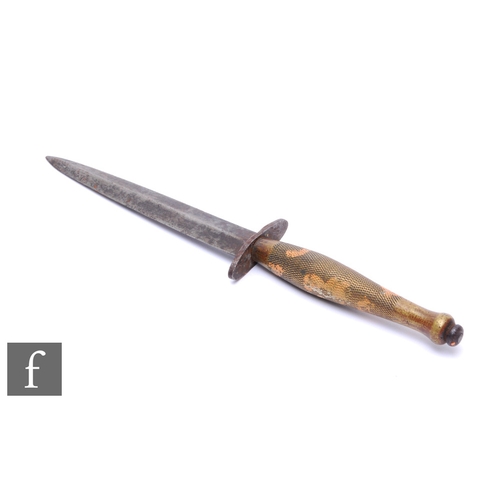 717 - A World War Two Fairbairn Sykes fighting knife, 15.5cm blade, second pattern, chequered brass grip.