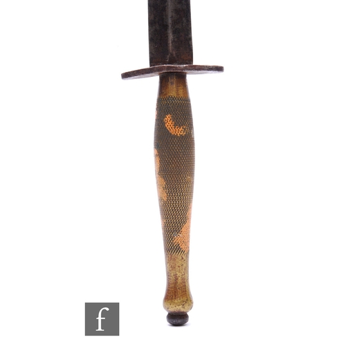 717 - A World War Two Fairbairn Sykes fighting knife, 15.5cm blade, second pattern, chequered brass grip.