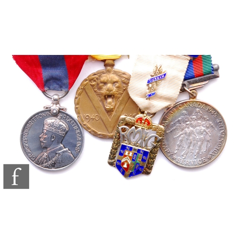 736 - A Belgium Victory Medal, an Imperial Service Medal, a Canadian Voluntary Medal and a silver Steward ... 