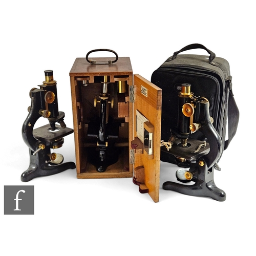 786 - A 20th Century part brass microscope by E.Leitz Wetzlar No 153750, cased, another by Watson service ... 