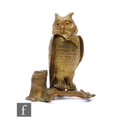 802 - A 19th Century gilt bronze inkwell modelled as a perched owl standing on a branch, hinged head to co... 