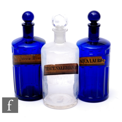 836 - Two 19th Century cobalt blue cylindrical chemist bottles, each with ball stoppers over part ribbed s... 