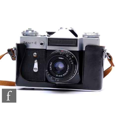 842 - A Zenit-E 35mm camera in black leather case.