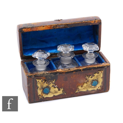 848 - A Victorian domed leather casket fitted with three glass scent bottles, gothic style brass work and ... 