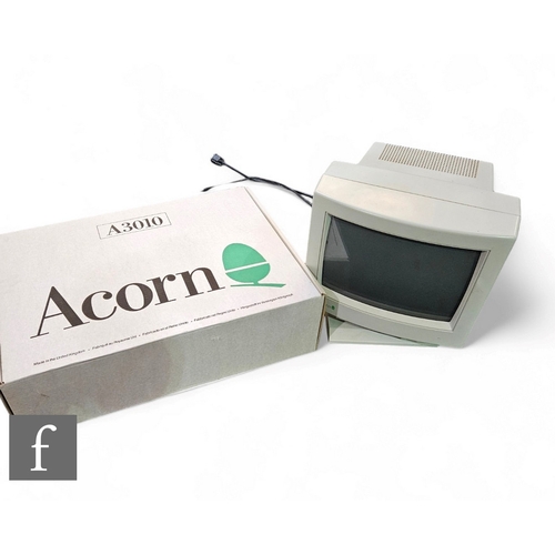 853 - An early 1990s Acorn A3010 computer, including monitor, keyboard, mouse, instruction manuals with or... 