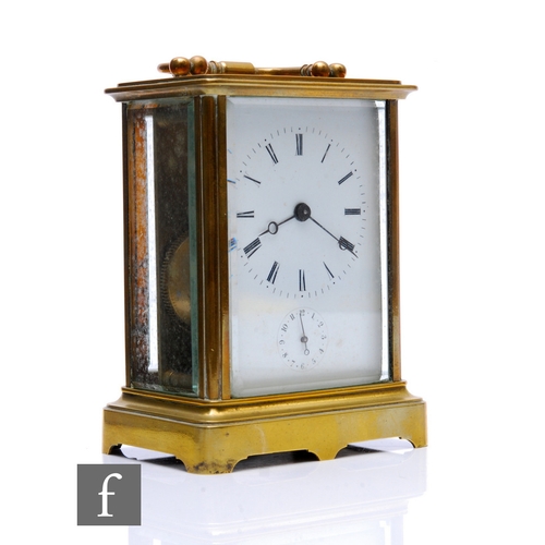 874 - A late 19th Century French brass carriage clock, white enamelled dial, the movement striking on a be... 