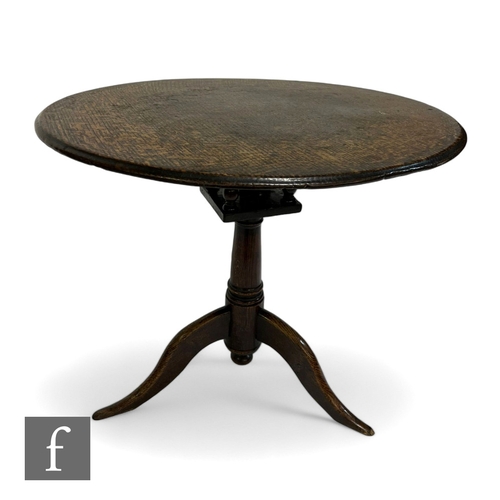 1007 - A George III oak circular tripod occasional table with a bird cage movement and an Art Nouveau coppe... 