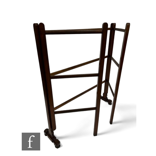 1046 - A Victorian floorstanding mahogany double folding clothes horse on shaped and turned end supports, h... 