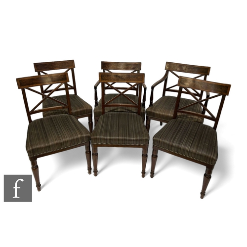 1057 - A set of six George IV crossbanded mahogany bar back dining chairs, the cross splats centred by a fl... 