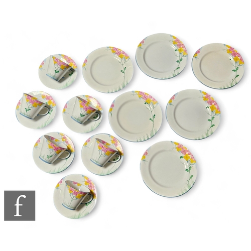 268 - An Aynsley part floral tea set painted with spring flowers on a white ground, comprising six tea cup... 