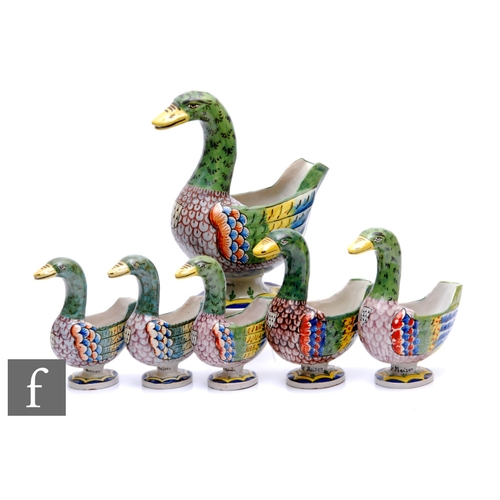 188 - A graduated set of six early 20th Century Quimper faience ducks, each modelled as a stylised duck pi... 