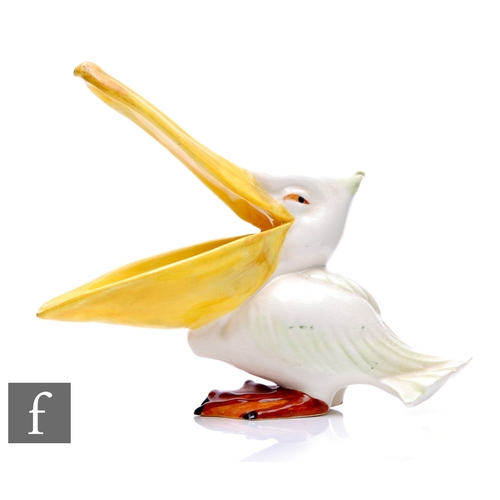 195 - A 1930s Wade Pottery model of a pelican with large open mouth, picked out in enamel colours, printed... 