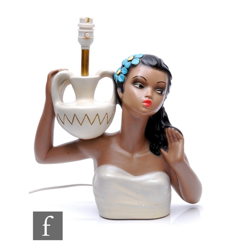 208 - A 1960s Chalkware table lamp modelled as a young lady with flowers in her hair carrying a twin handl... 