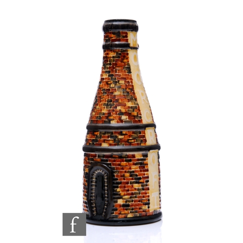 209 - A Moorcroft Pottery vase modelled as a bottle kiln designed by Rob Tabbenor, printed and painted mar... 