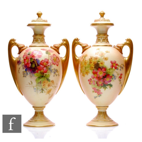 222 - A pair of early 20th Century Royal Worcester pedestal urns and covers, shape 2158, each of slender o... 