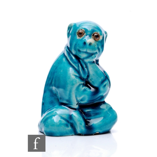 251 - A late 19th Century Arts & Crafts ceramic figure of a seated monkey in robes, in the manner of B... 