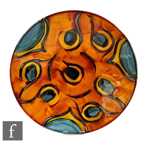 295 - A large later 20th Century Poole Pottery wall plaque or charger of shallow circular form, decorated ... 